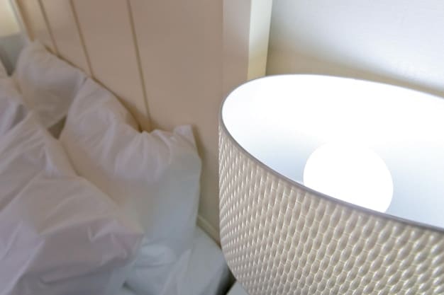 A close-up of a comfortable bed with high-quality, breathable linens and pillows. Soft, ambient lighting is present in the background, creating a relaxing and inviting atmosphere.
