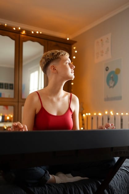 A person practicing gentle yoga or stretching in a dimly lit room, with a focus on relaxation and mindfulness. Soft music is playing in the background, and the atmosphere is peaceful and calming.