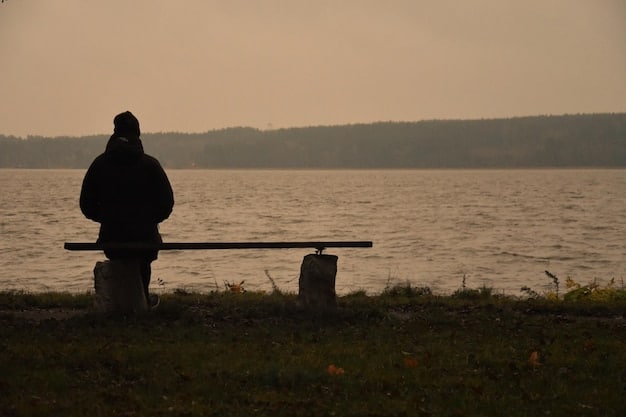 An individual sitting alone on a park bench, looking distressed, with muted, desaturated colors to convey a sense of isolation and mental distress.