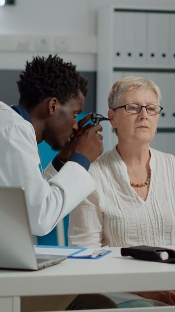 A close-up of a digital retinoscopy exam in progress with a focus on non-verbal communication between the patient and the medical professional.