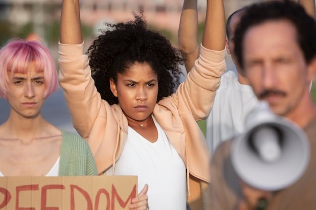 A group of diverse protestors holding signs advocating for various social causes, such as climate action, women's rights, and racial justice.