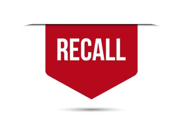 A close-up shot of a food product label, clearly showing a lot number and expiration date, with a subtle 