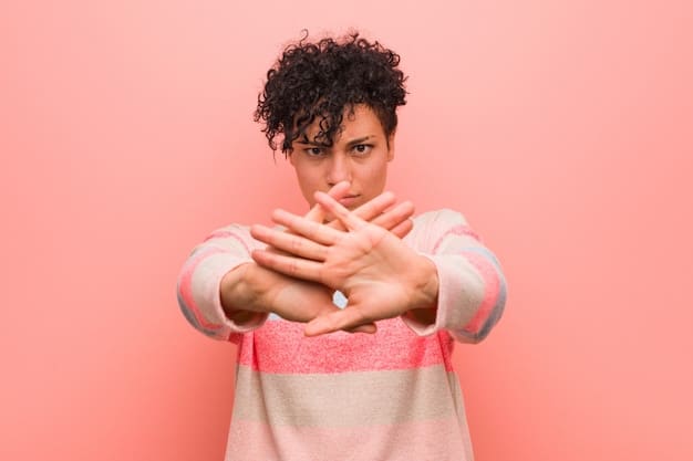 A close-up of a person sneezing into their elbow, demonstrating proper respiratory etiquette to prevent the spread of germs.