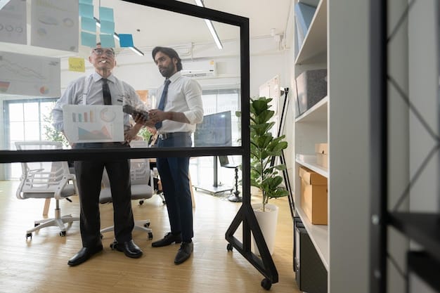 A diverse group of business professionals in a modern office collaborating around a digital whiteboard, illustrating strategic planning and problem-solving, with charts and graphs in the background indicating growth.