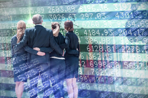 A team of business professionals collaboratively analyzing large data sets on a large interactive screen, surrounded by charts and graphs, representing a data-driven culture and collaborative insights.