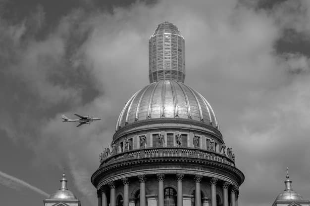 A photograph of the US Capitol Building with an upward-trending arrow superimposed over it, symbolizing government influence and economic progress. The sky above is clear and bright, suggesting optimism. The photograph's composition aims to visually represent the impact of government policies on the nation's economic recovery in relation to questions around 