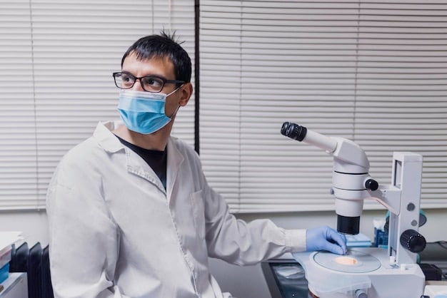 A scientist in a lab coat and protective eyewear examining a sample under a microscope, with various lab equipment and beakers in the background. The scene conveys scientific investigation and the urgency of understanding the virus strain related to Alert: Public Health Emergency Declared Due to New Virus Strain - Take Precautions Now
