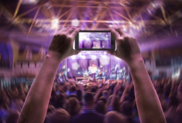 A wide shot of a music festival crowd, with a large screen displaying a VR feed of the performance. Some attendees are wearing VR headsets, while others are watching the screen, creating a mix of real and virtual experiences. The image illustrates how VR is integrated into music festivals to enhance accessibility in 'The Future of Concerts: Exploring Virtual Reality and Immersive Experiences'.