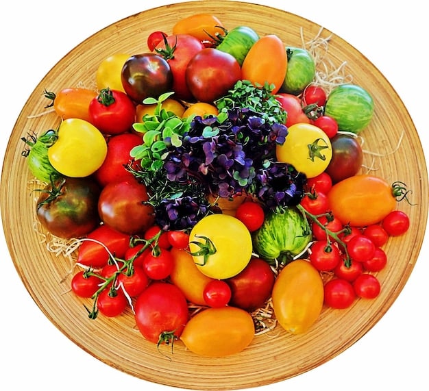 A colorful plate filled with various fruits and vegetables, including berries, leafy greens, tomatoes, and carrots. The meal is well-balanced and visually appealing, emphasizing healthy eating for hypertension.