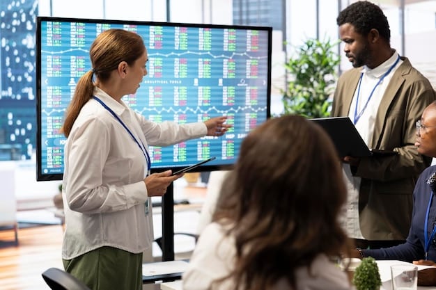 A diverse group of business people from various departments collaborating on a digital marketing strategy, looking at customer segmentation data on a large screen.