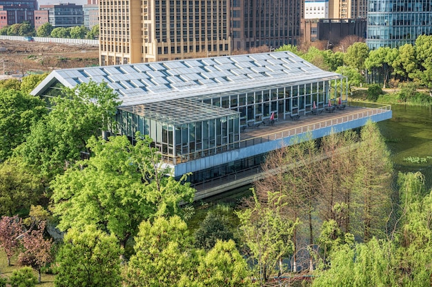 A modern, eco-friendly business complex powered by solar panels, demonstrating sustainability efforts and compliance with environmental regulations in 2025 . Focus on green energy, sustainable business practices and environmental responsibility.